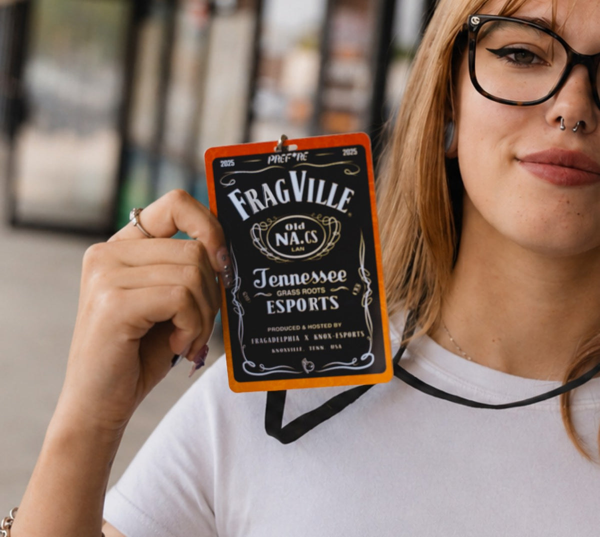 A FragVille 2025 lanyard badge with the PREF*RE logo