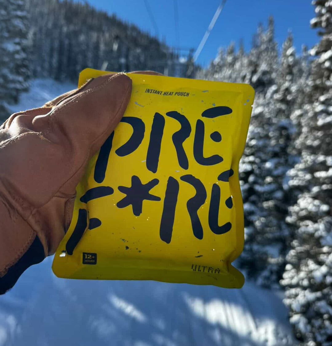 PREF*RE ULTRA pouch held in a gloved hand on a ski lift