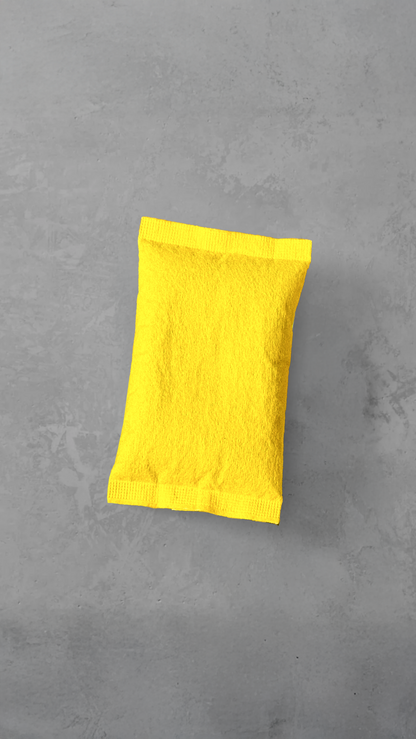Holding a yellow Pref*re hand warmer pouch